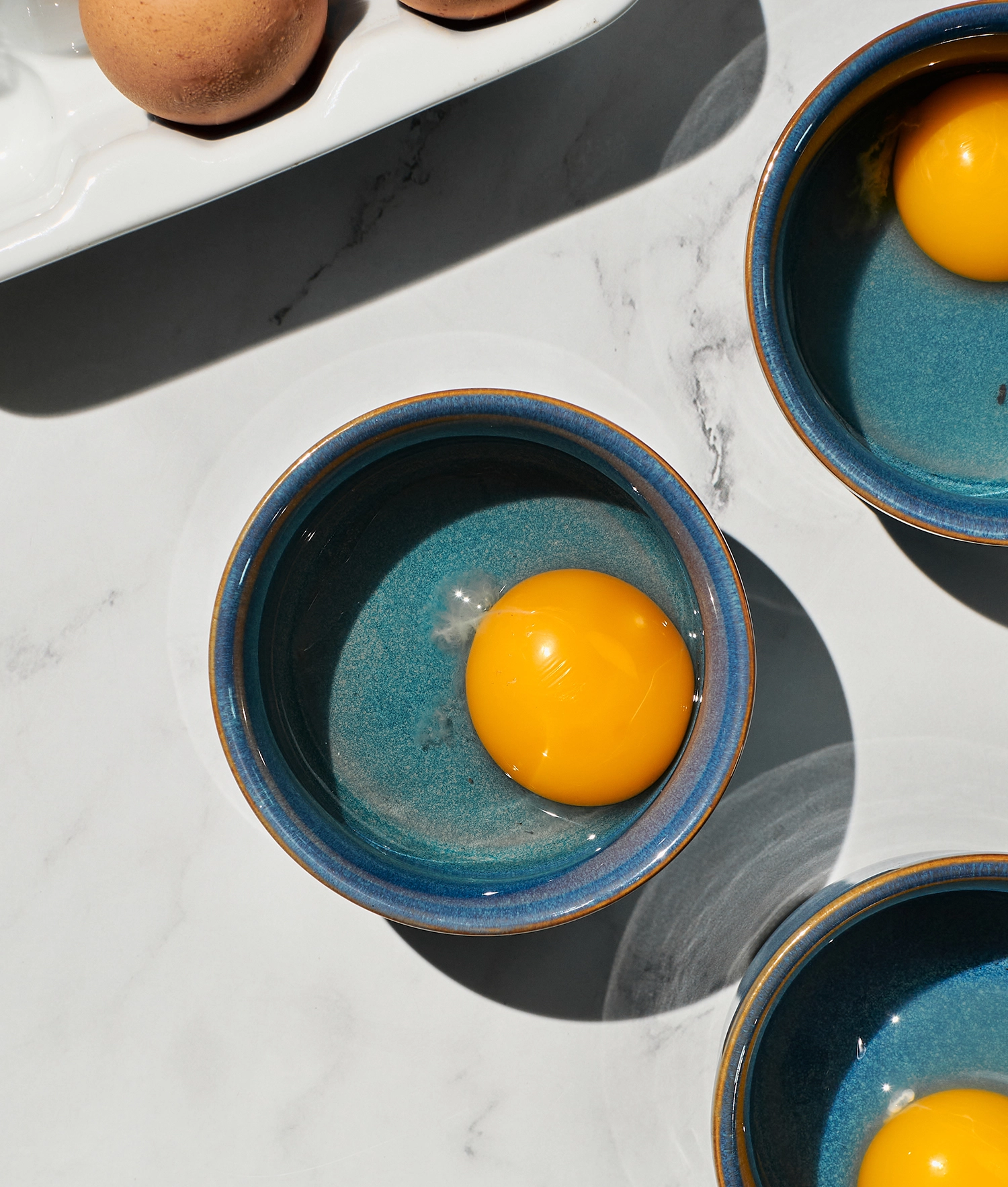 Two eggs cracked into a small bowl.