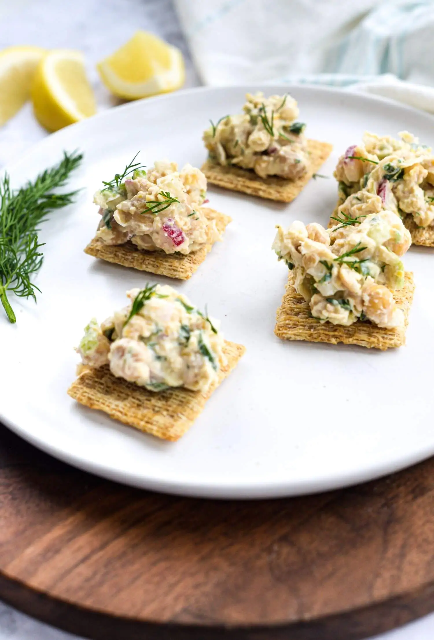 Chickpea salad garnished and served with crackers