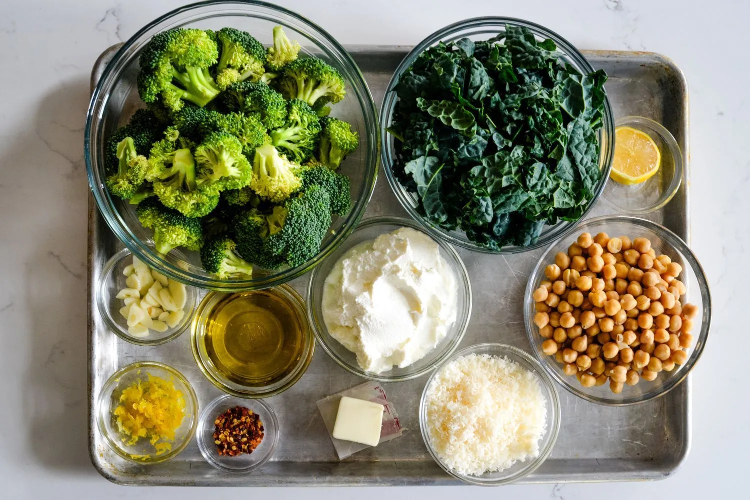 Ingredients for a creamy broccoli ricotta pasta with lemon.