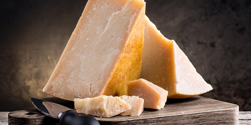 Slices of Parmesan cheese with viable naturally formed rind.