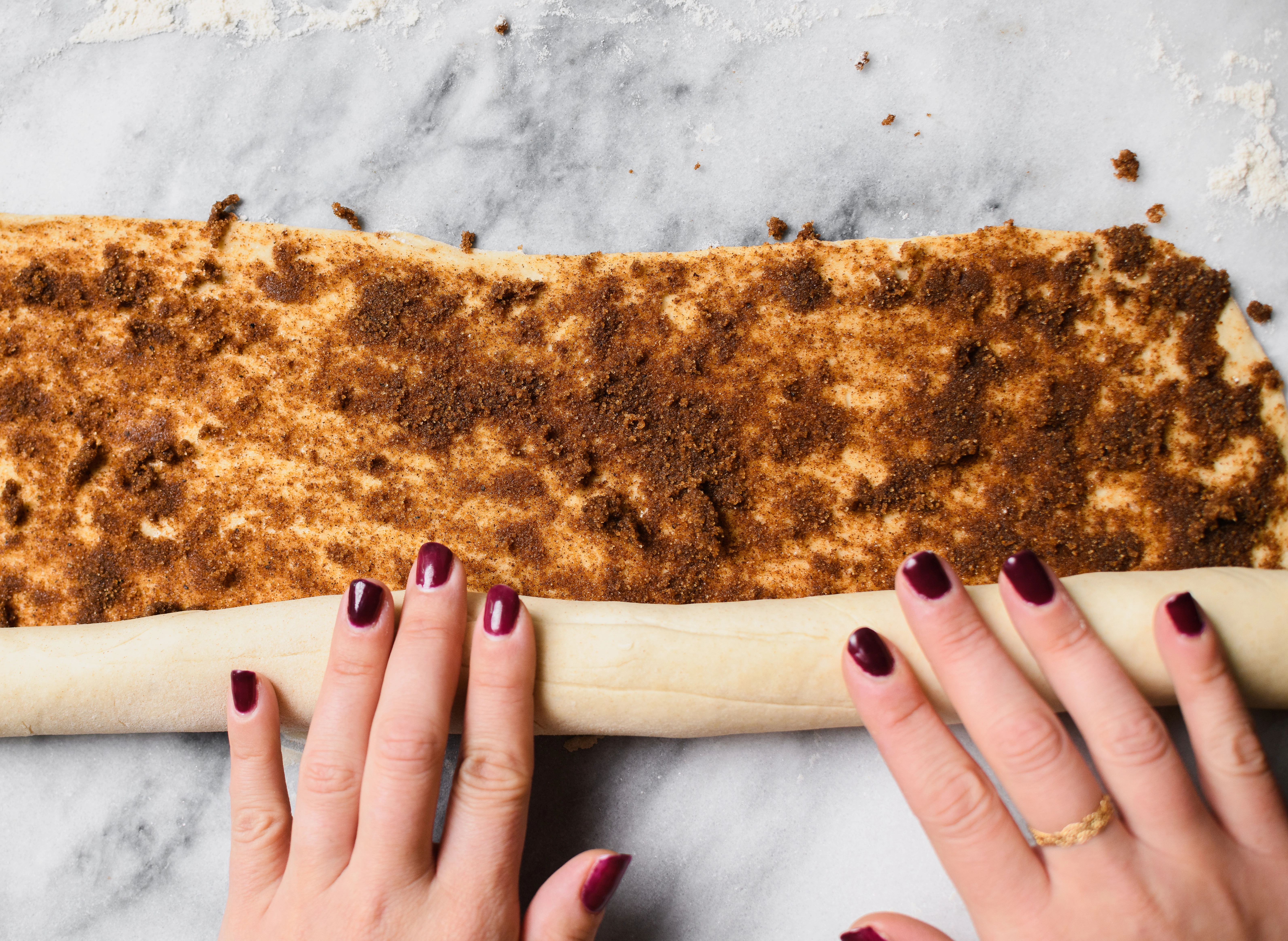 Greek yogurt cinnamon roll dough layered with spice mixture including chai, cinnamon. and brown sugar.