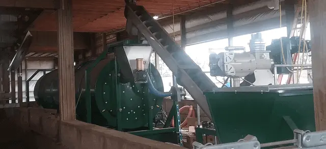 A large composter on a dairy farm