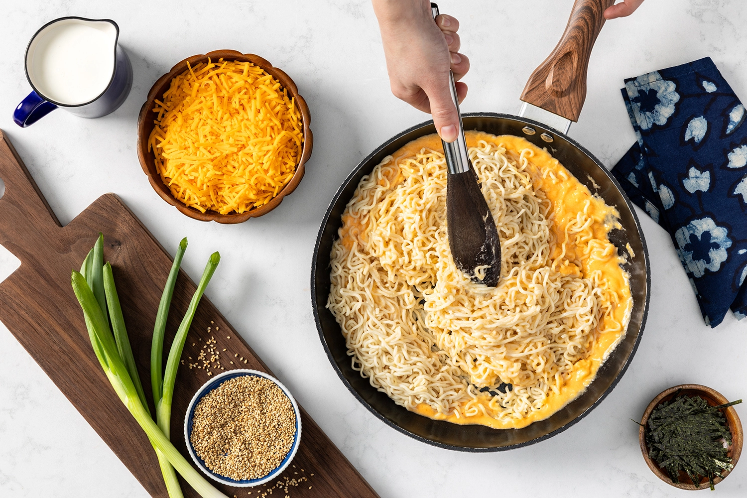 cooked ramen noodles tossed and combined cheddar cheese sauce.