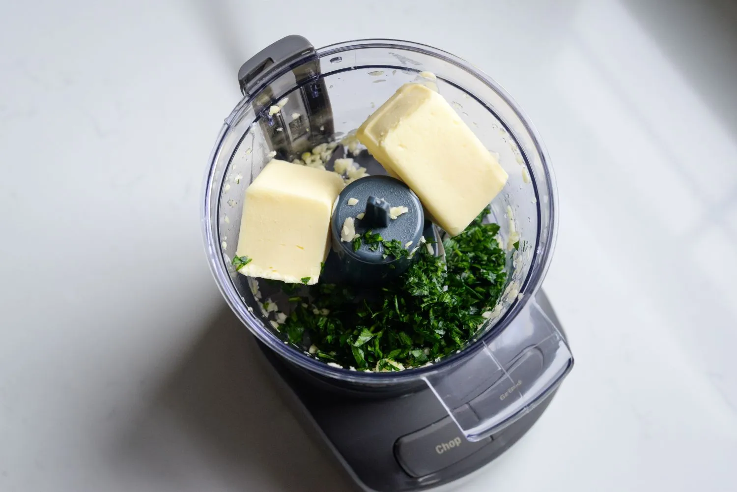 Butter, garlic, and parsley in a food processor.
